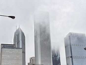 Low angle view of skyscrapers against sky