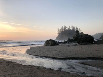 Scenic view of sea against sky at sunset
