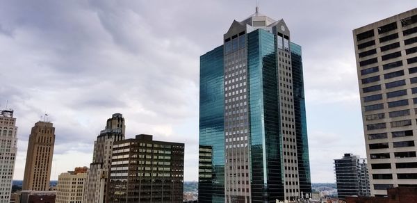 Low angle view of buildings in city against sky