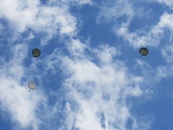 Low angle view of hot air balloons against sky