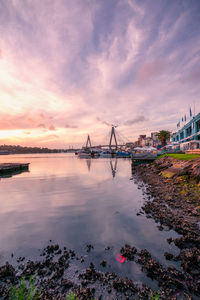 View of bridge over sea against cloudy sky