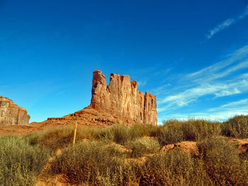 View of rock formations against blue sky