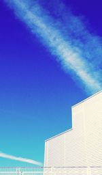 Low angle view of building against blue sky