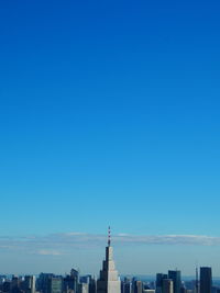 Cityscape against clear blue sky