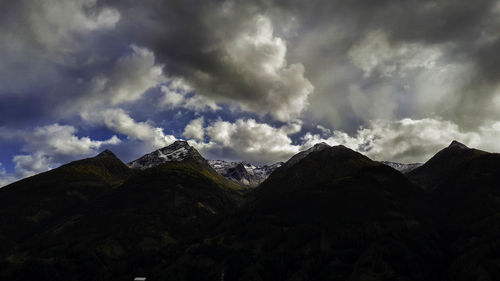 Scenic view of mountains against dramatic sky