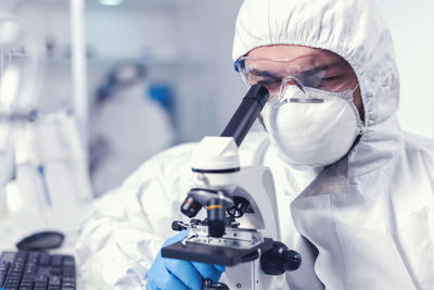 Midsection of scientist working in laboratory