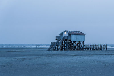 Pile dwelling on the beach of sankt peter-ording in germany.