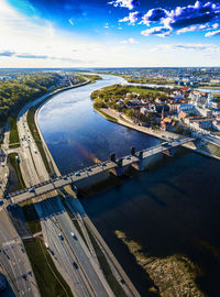 High angle view of bridge over river in city against sky