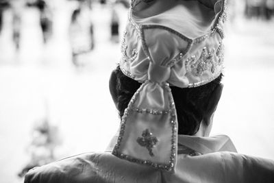 Rear view of woman with arms raised