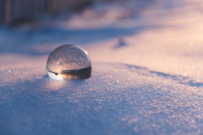 Close-up of crystal ball on table