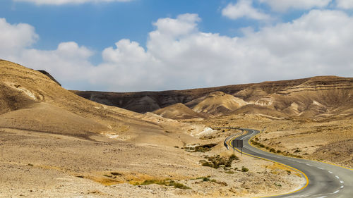 Scenic view of mountain road against sky