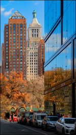 Buildings in city against sky