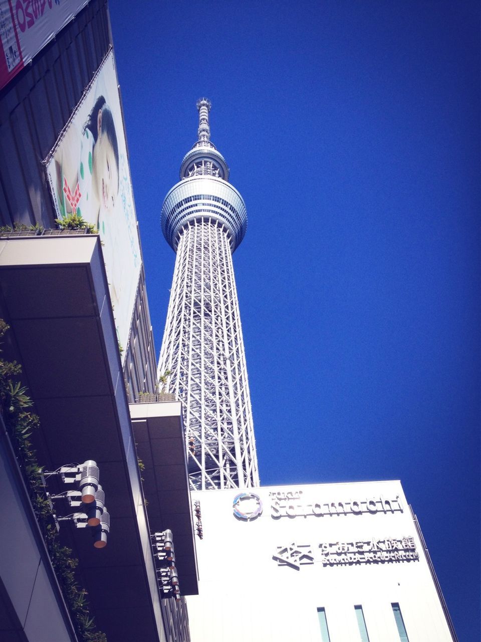 architecture, built structure, building exterior, low angle view, clear sky, modern, tower, city, tall - high, blue, building, skyscraper, copy space, office building, communication, no people, tall, outdoors, day, capital cities