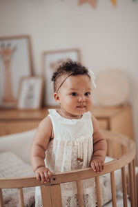 Portrait of cute baby at home