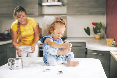 Mother and son on table