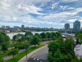 High angle view of trees and buildings against sky