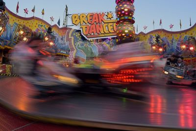 Illuminated carousel at amusement park