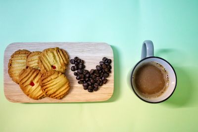 High angle view of cookies and coffee on table
