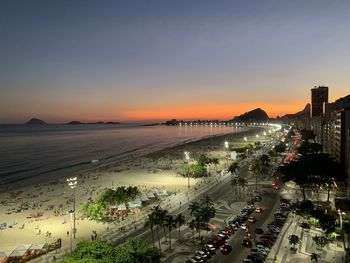 High angle view of city at sunset