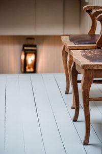 Close-up of empty chair on table at home