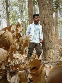 Full length of young man in forest