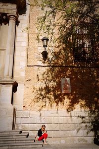 Woman in front of building