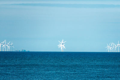 Close-up of sea against clear blue sky