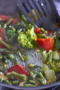 Close-up of chopped vegetables in cooking pan