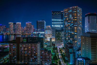 Illuminated buildings in city at night