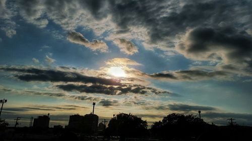 Cloudy sky above city at sunset