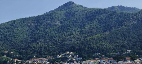 High angle view of townscape and mountains against sky