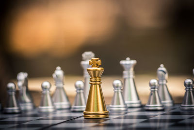 Close-up of chess pieces on table