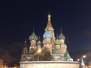 Illuminated cathedral against sky at night