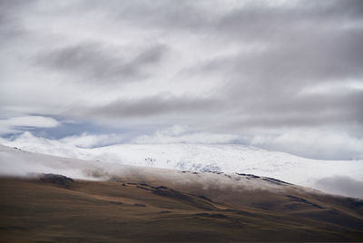 Scenic view of snowcapped mountain against sky