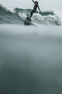 Black woman surfing