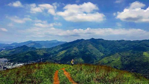 Scenic view of mountains against cloudy sky