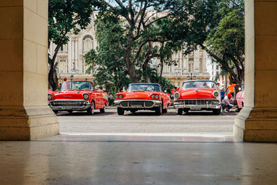 Cars on street against buildings in city