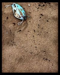 High angle view of shoes on sand