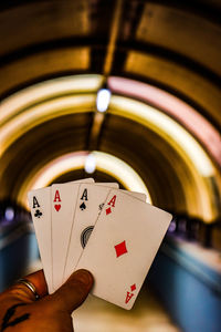 Close-up of hand holding playing cards