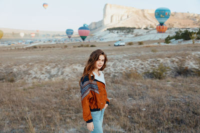 Young woman standing on field