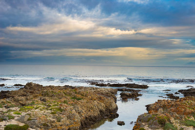 Scenic view of sea against sky at sunset