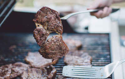 Close-up of meat on barbecue grill