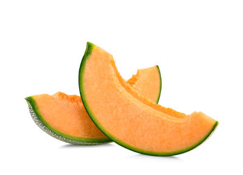 Close-up of orange fruit against white background