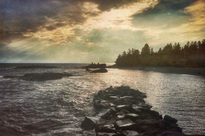 Scenic view of sea against cloudy sky