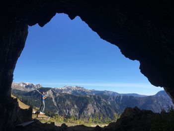 Scenic view of mountains against blue sky