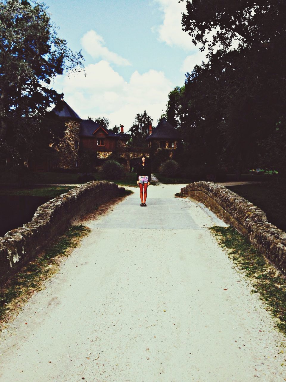 architecture, built structure, tree, sky, building exterior, lifestyles, the way forward, leisure activity, person, incidental people, travel, men, travel destinations, tourist, walking, tourism, famous place, bridge - man made structure, unrecognizable person