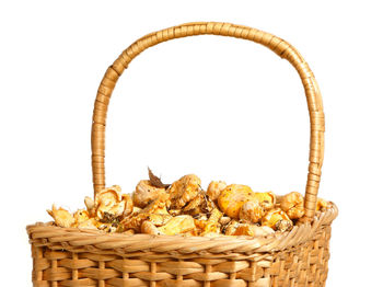 Close-up of wicker basket against white background