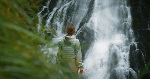 Low angle view of waterfall in forest