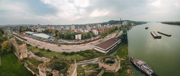 High angle view of cityscape against cloudy sky