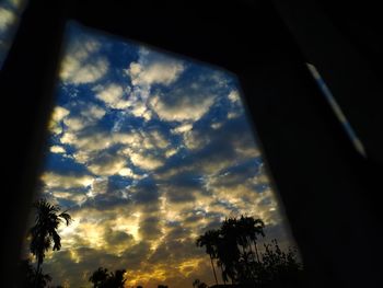Low angle view of silhouette trees against sky during sunset